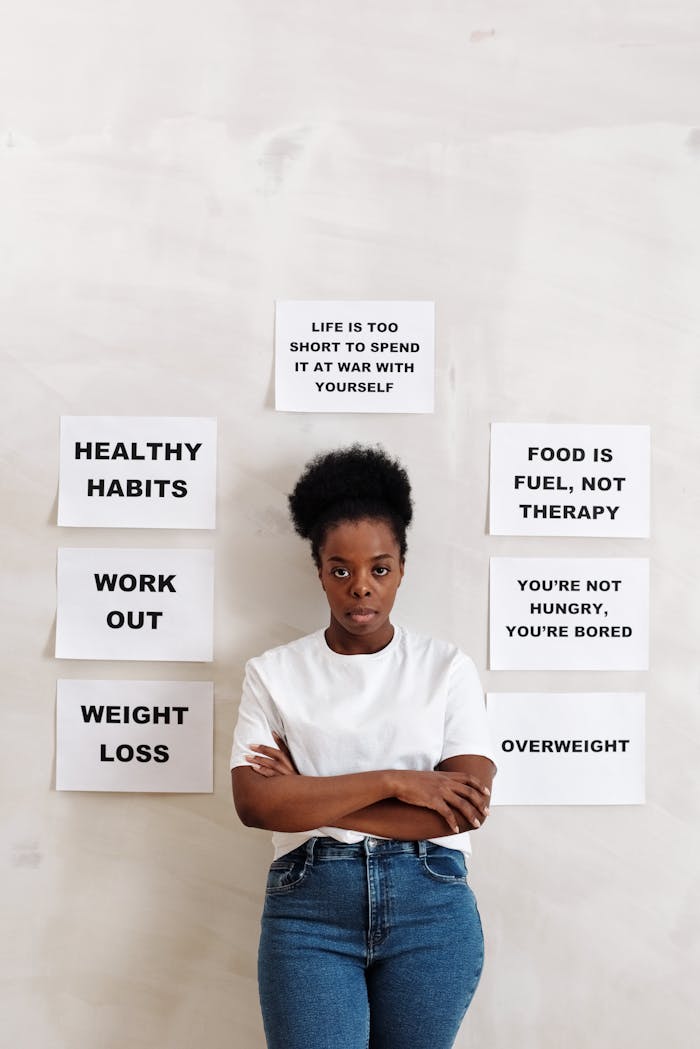 brand-02 A woman stands in front of health messages promoting positive lifestyle changes.